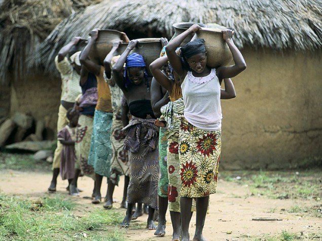 Young women and gils carry water - Nigeria
