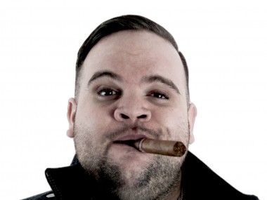 Promotional photo of the Australian rapper Briggs with a cigar